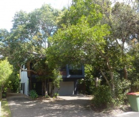 8 Belle Court - Rainbow Shores - Relax on the deck overlooking bushland whilst listening to the waves crash on the shore