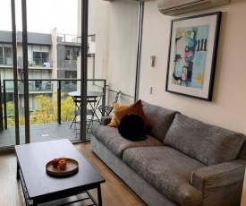 Sunny Balcony Over a Calm Private Garden