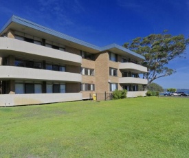 Right on the sands at Little Beach and walk to the heart of Nelson Bay